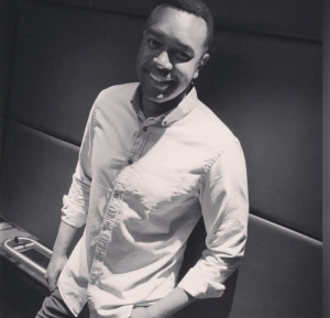 Isaiah Mejah standing against a wall