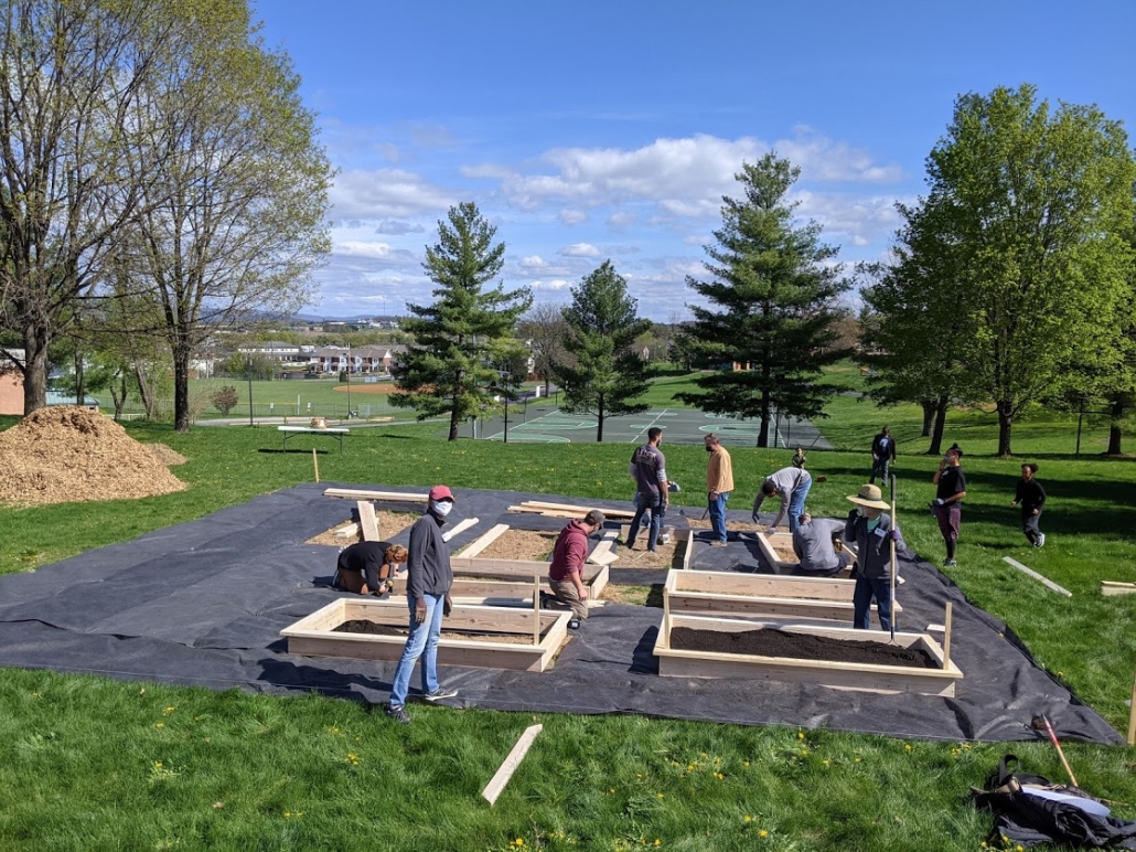 Kelley Street Garden build day Volunteers build garden boxes, fill boxes with soil, and help with the Kelley Street garden April 17 during community build day